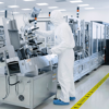 Sterile High Precision Manufacturing Laboratory where Scientists in Protective Coverall's  Sterile High Precision Manufacturing Laboratory where Scientists in Protective Coverall's