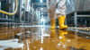 Hygiene cleaning worker in food industry floor cleaning suit
