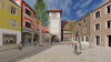 Systemfinder EFH_FINAL: Belebte Altstadtstraße mit Turm, bunten Häusern und markierten Smart‑City‑Funktionen im Überblick